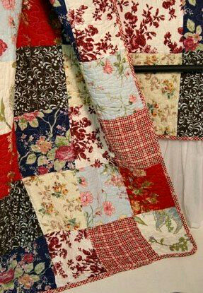 Patchwork quilt in reds and cream