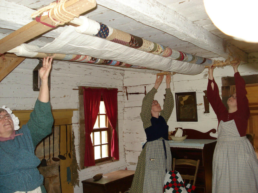 a quilt frame stored near the ceiling