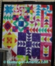 Vivid colors in star and flying geese quilt