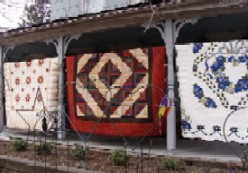 Amish quilts on a porch